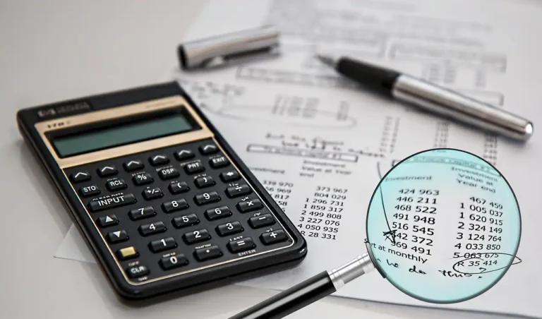 Verification process with a calculator, financial documents, and a magnifying glass highlighting numbers, representing thorough partner credential verification