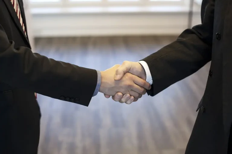 Business handshake symbolizing successful partnerships with Indian hospitals and healthcare providers