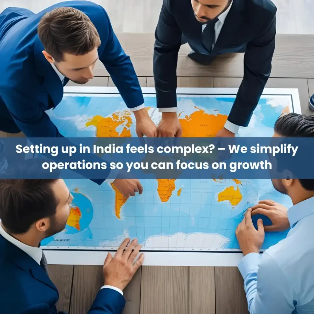 Business professionals strategizing global expansion with a world map, focusing on entering the Indian market.